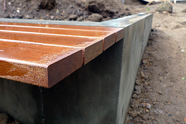 Wood Bench and Concrete Wall